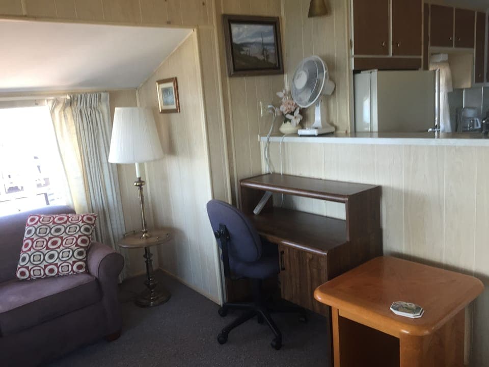 Couch turns into a second bed. Desk and fan are available.