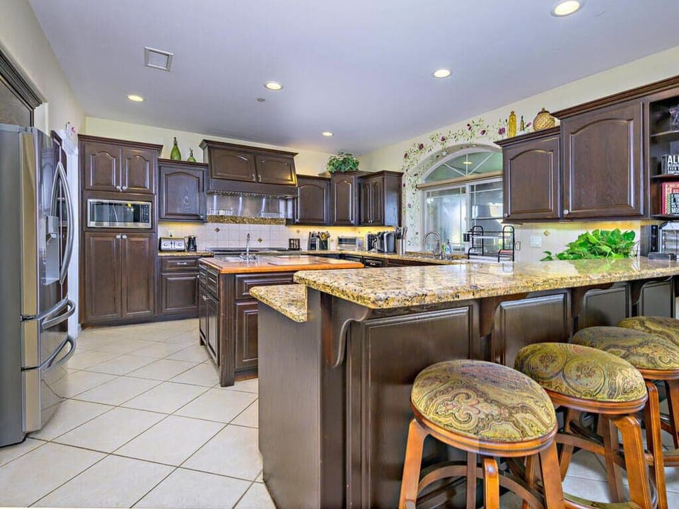 Chef's Open-Kitchen overlooking Backyard and views.