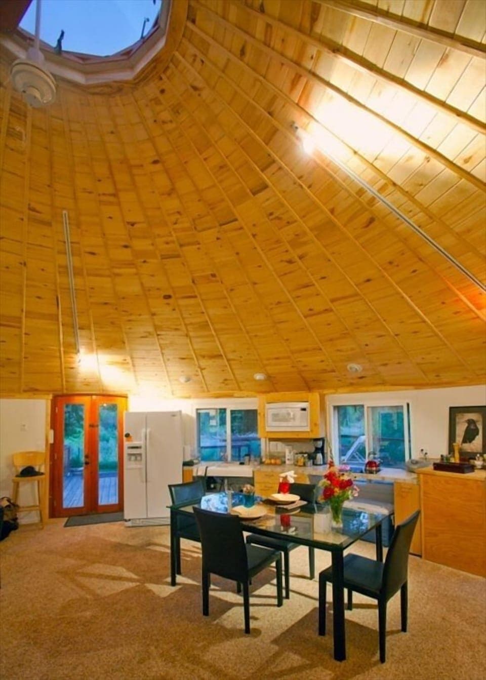 Dining table / with Kitchen behind. The river flows left to right just outside. 