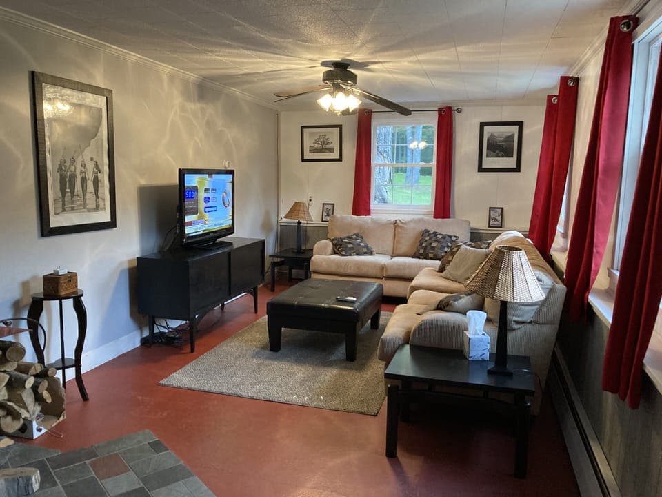 Downstairs family room with wood burning fireplace 