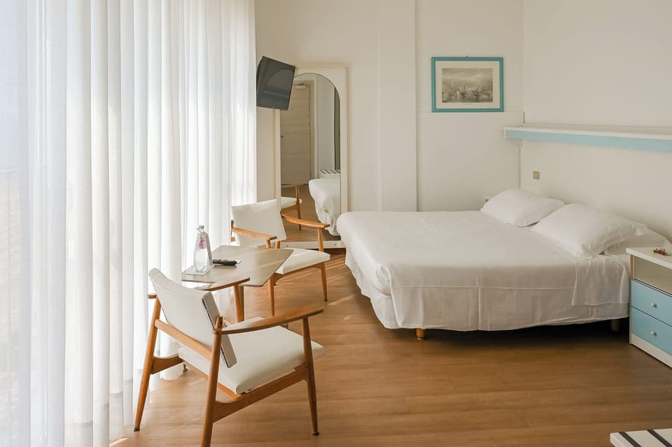 Family Room, Balcony, Sea View (laterale) | In-room safe, desk, soundproofing, iron/ironing board