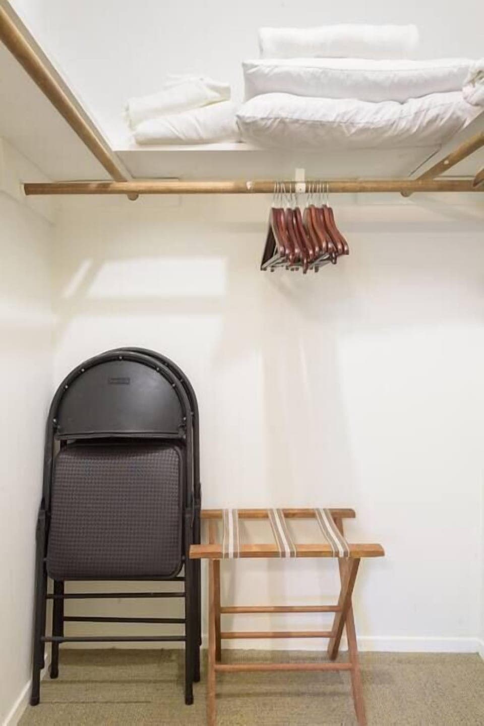 Walk-in closet with luggage rack, extra chairs for the dining table, cotton blankets for the beds and linens for the pull out couch.