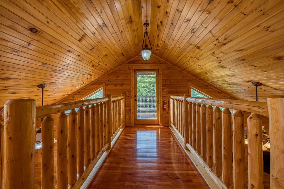 Loft hallway to private balcony with mountain views