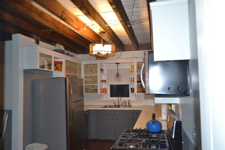 well stocked, updated kitchen with rustic charm
