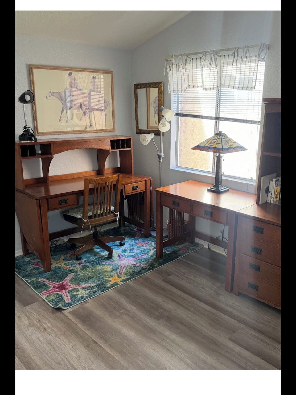 Office with ample workspace and daybed