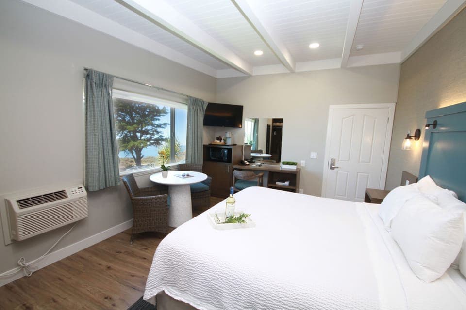 Shower, designer toiletries, hair dryer, towels