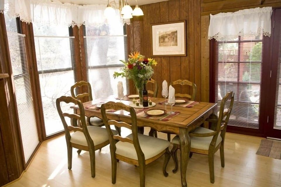 Dining Room, French doors abound, access to downstairs patio/deck and garden.