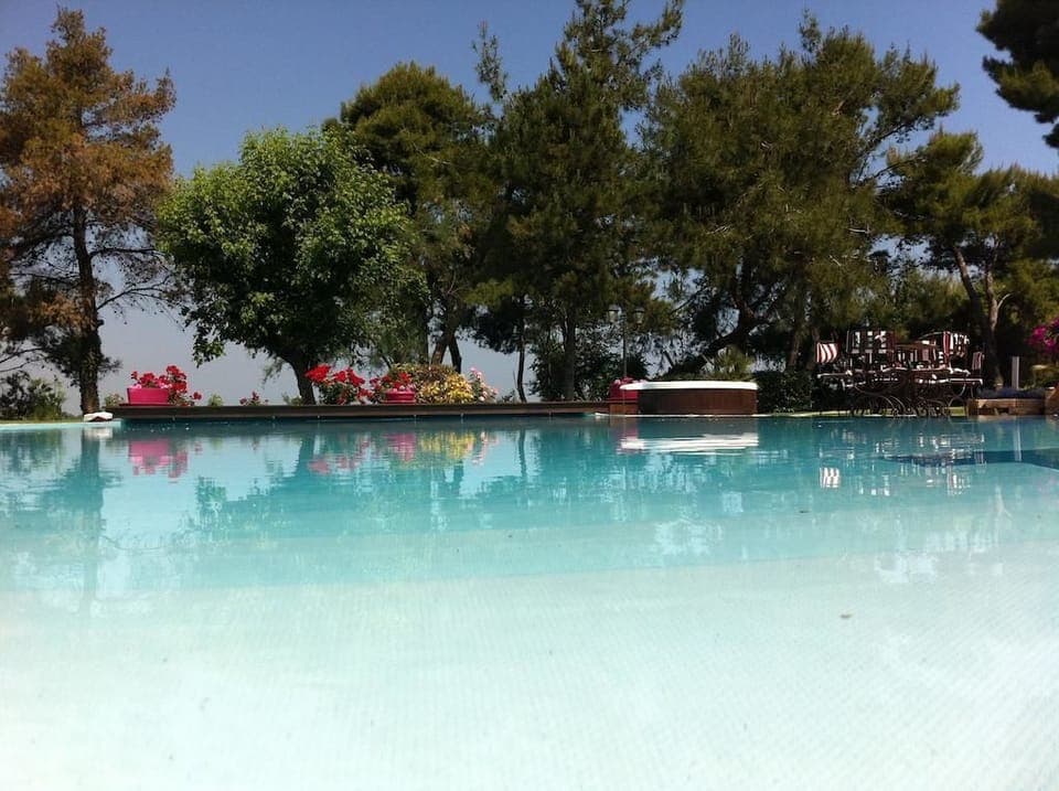 Seasonal outdoor pool, open 8:00 AM to 7:00 PM, sun loungers