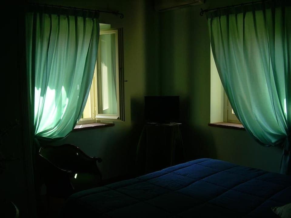 Double or Twin Room | Minibar, in-room safe, individually furnished, blackout drapes