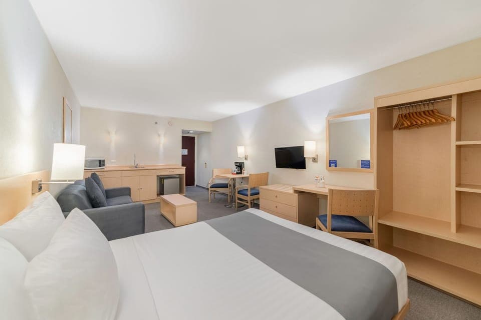 Down comforters, desk, blackout drapes, iron/ironing board