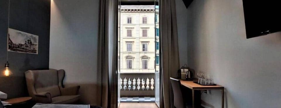 Deluxe Room, Balcony, City View | Desk, laptop workspace, soundproofing, iron/ironing board