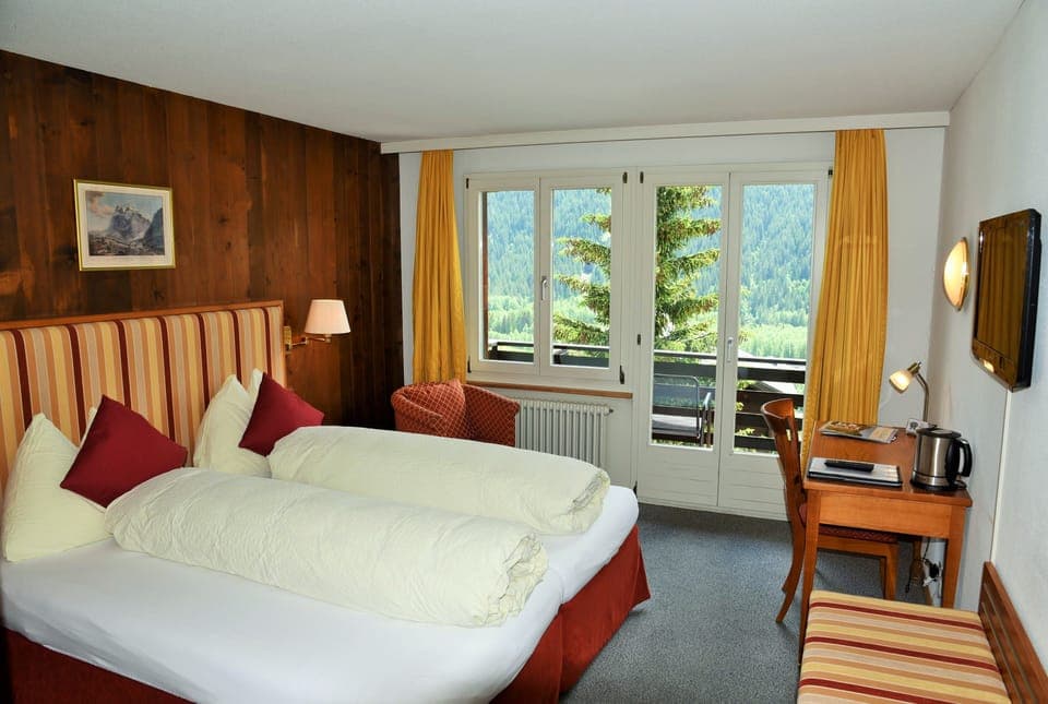 Panoramic Double Room, Balcony, Mountain View (Eiger) | Down comforters, individually decorated, individually furnished, desk