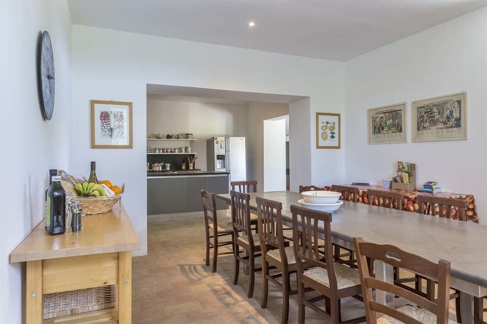 Kitchen dining area with basaltina stone table that seats 12