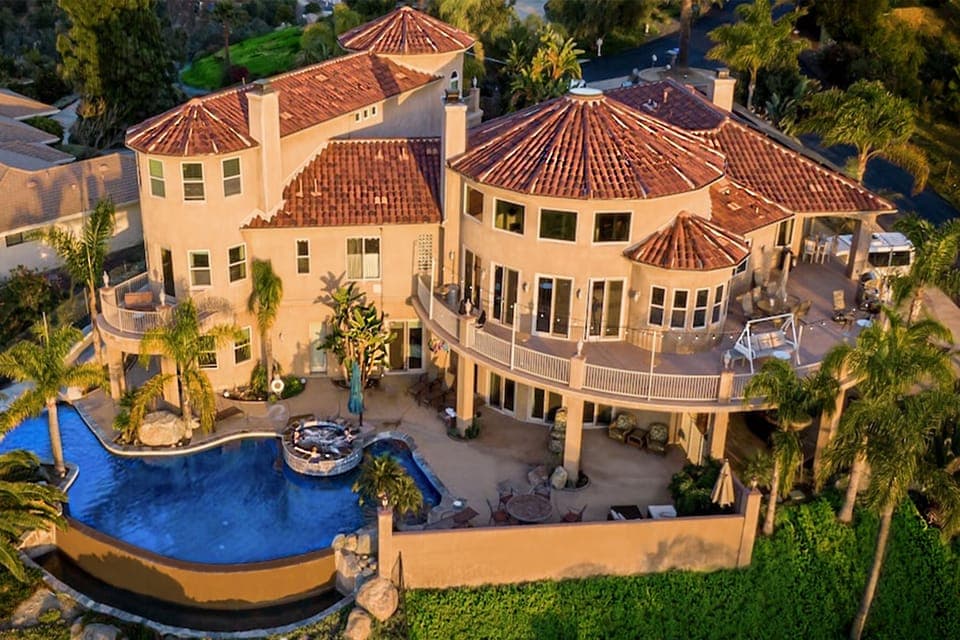 3 levels w/ 10k sq ft indoor living space & 7 suites, each with private baths