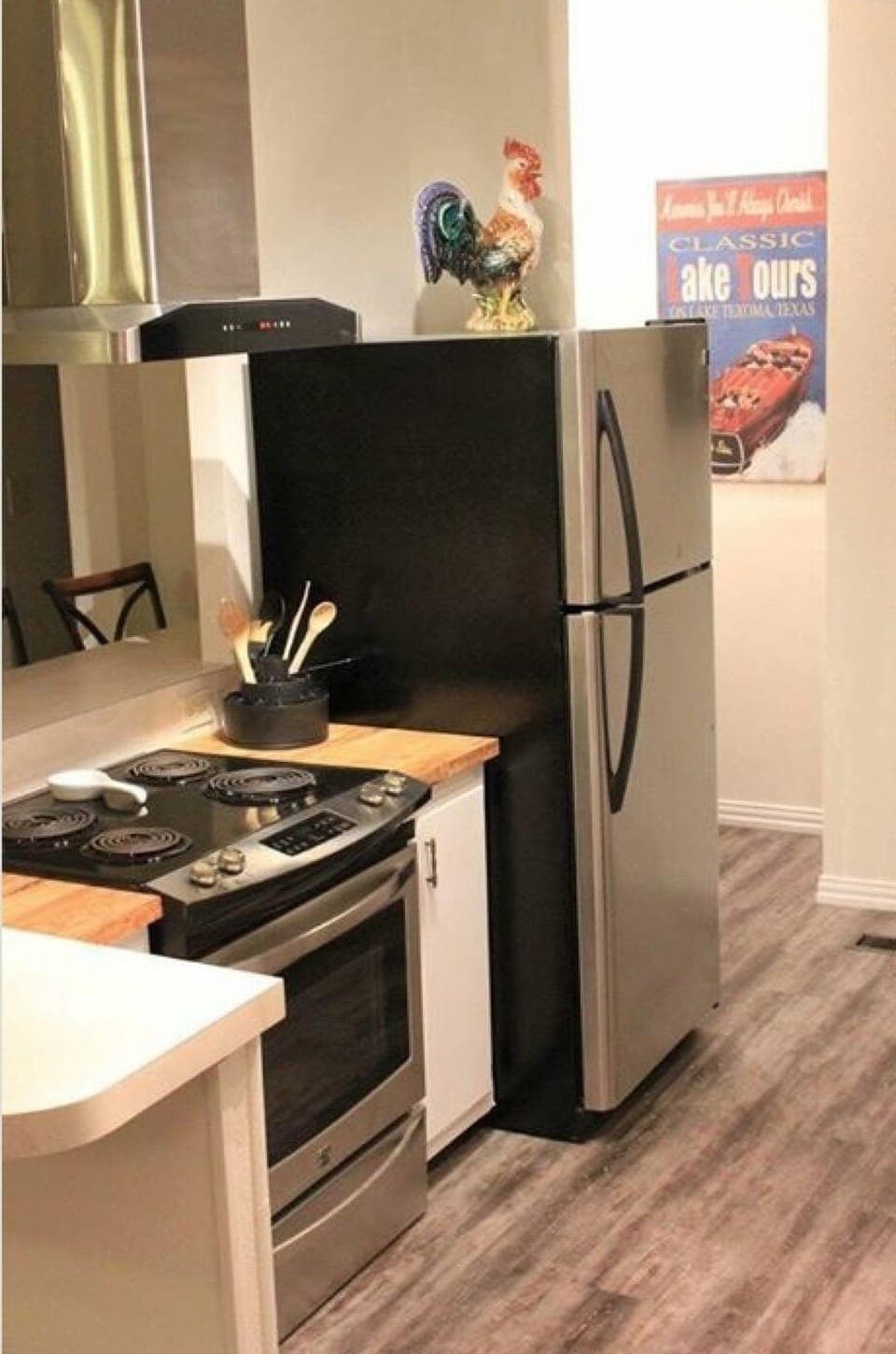 Kitchen showing the Oven/Stove and Refrigerator. Washer/Dryer in corner.