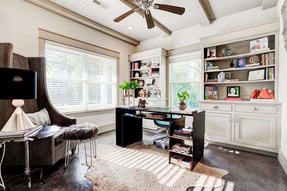 Sunlit private office, full of art and interesting books.