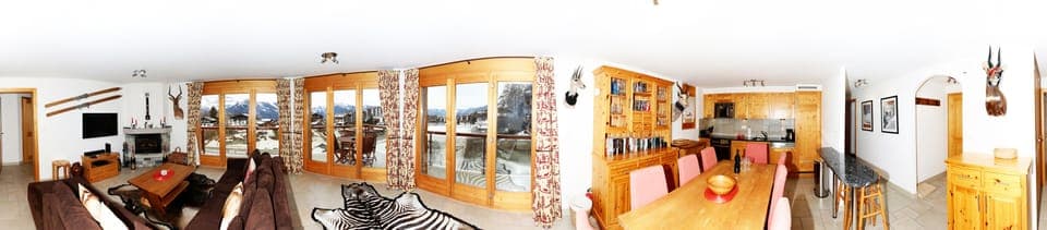 Panoramic view of sitting room & kitchen in winter