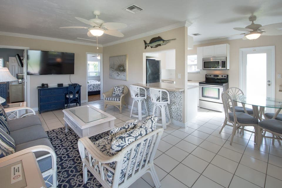 View from front door into villa | Open-kitchen engages a happy chef