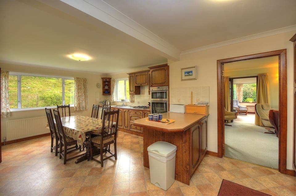 Kitchen diner which looks onto a hill field