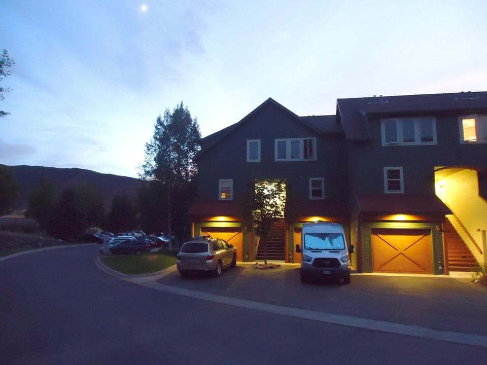 End-unit with parking in front of garage.