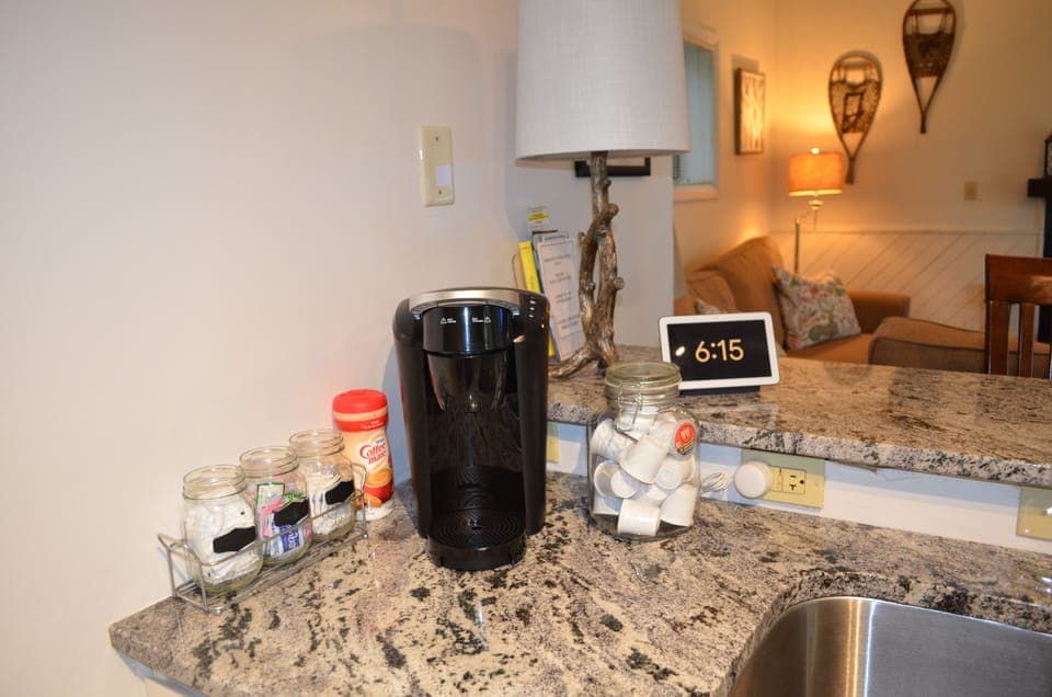 K-cups, sugar, creamer, tea, and hot chocolate provided.