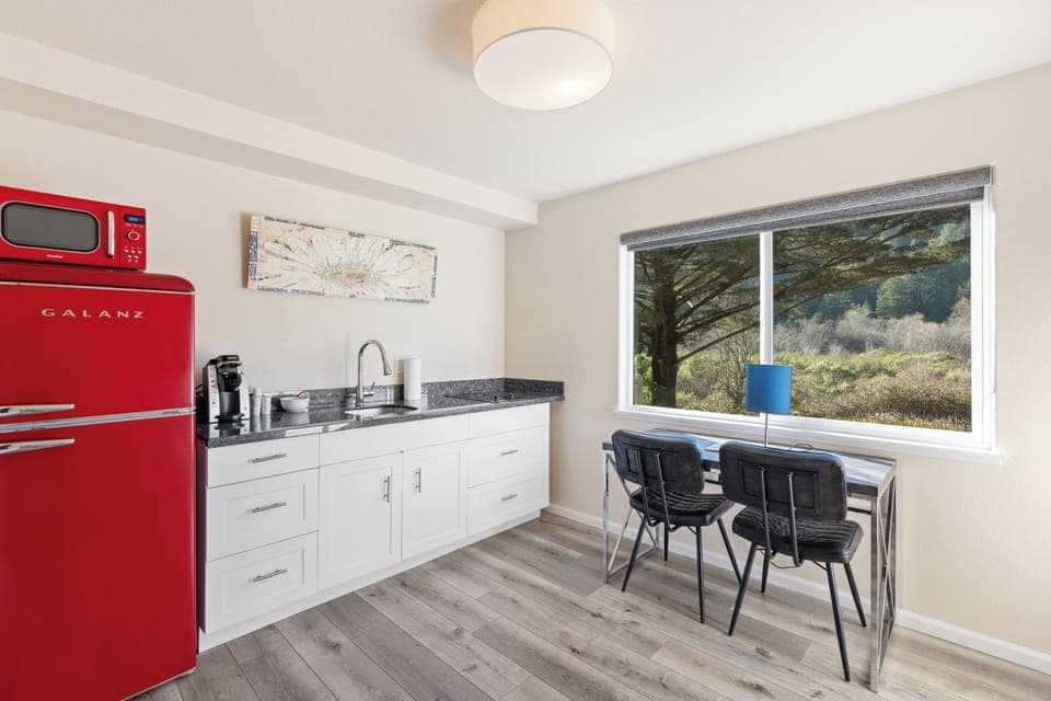 Deluxe Suite, 2 Queen Beds, Patio | Private kitchen | Fridge, microwave, coffee/tea maker, cookware/dishes/utensils