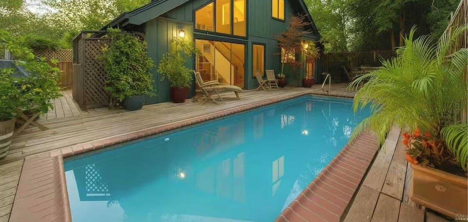 Modern retreat with floor-to-ceiling windows and a private pool. Enjoy a spacious deck, cozy interiors, and lush greenery - perfect for a peaceful escape.
