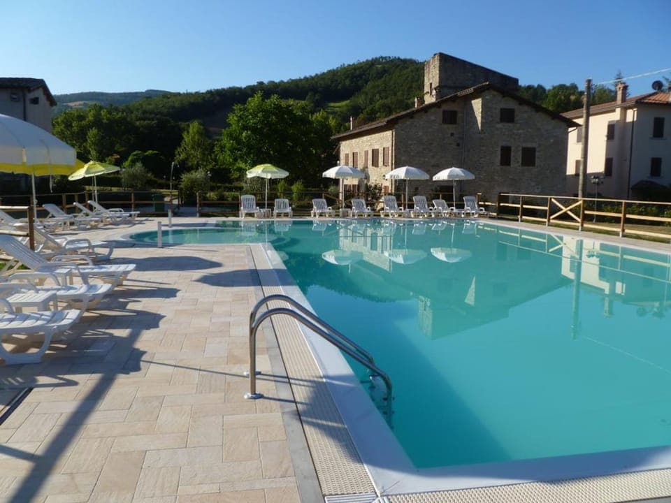 Seasonal outdoor pool, pool umbrellas, sun loungers