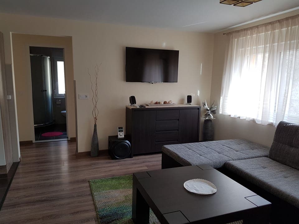 Apartment, 4 Bedrooms | Living room | Flat-screen TV