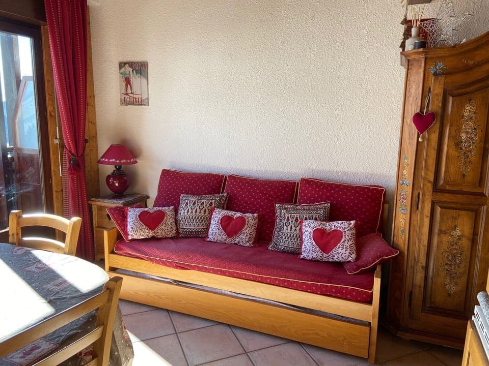 Sofa in living/dining area is 2 x single beds