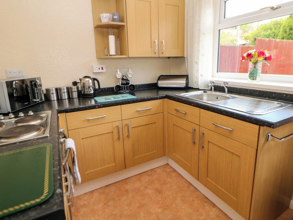 Cottage | Private kitchen | Fridge, microwave, stovetop, highchair