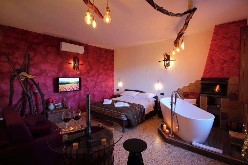 Suite, Bathtub | Minibar, individually furnished, blackout drapes, free WiFi