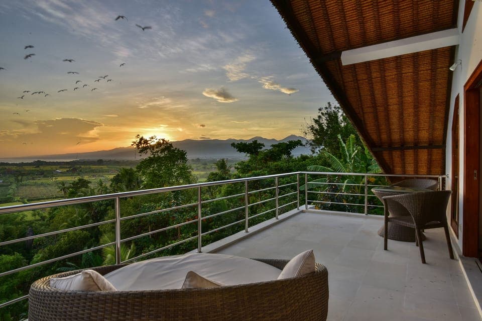 Sunrise over the hills of Lovina seen from master bedroom balcony
