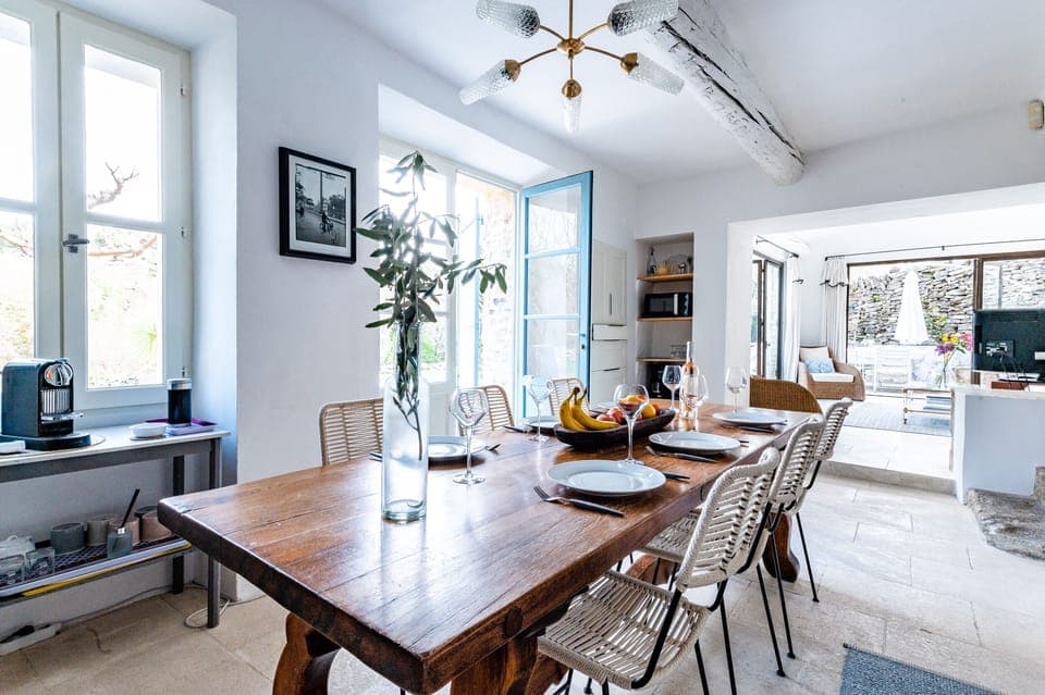 Kitchen dining room looking out to terrace and pool