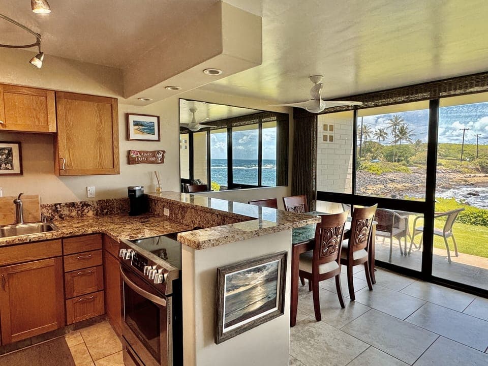 The view from the newly renovated kitchen is spectacular - the ocean calls!