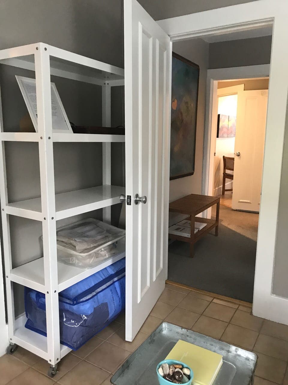 Bedding stored here with empty shelves to put your belongings