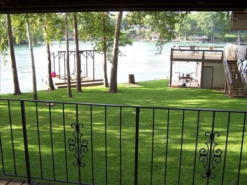 View of waterfront from Master Bedroom deck with table and chairs