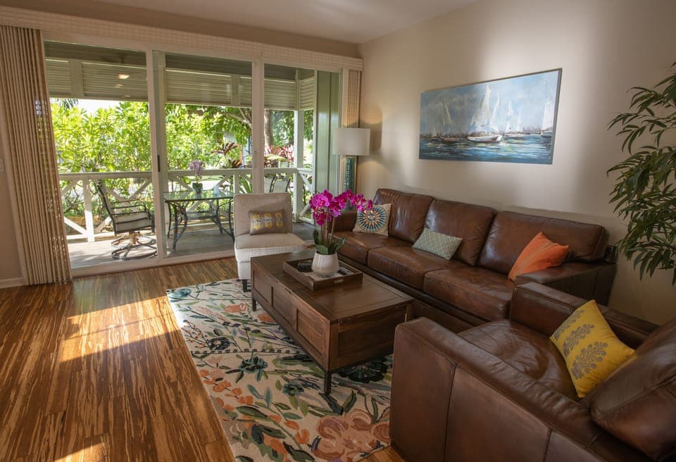 Bright, open-concept living area with seamless access to the main garden lanai.