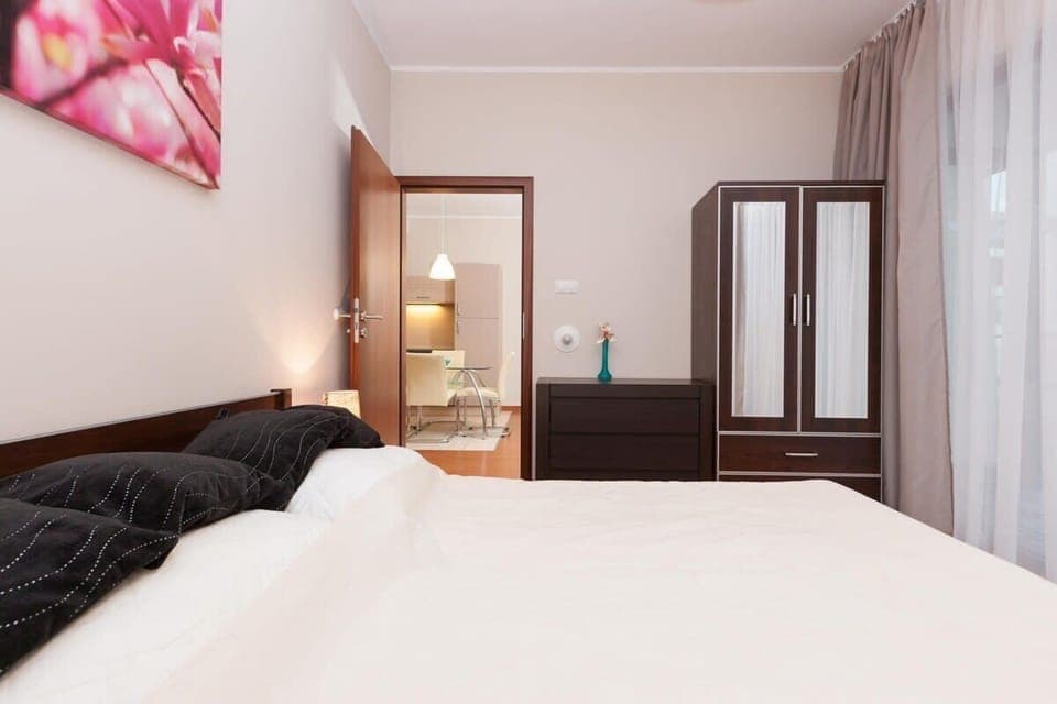 Another angle of the bedroom showing the double bed and cozy atmosphere.
