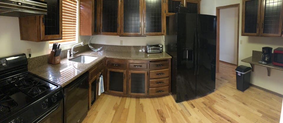 Good sized kitchen fully stocked with spices, pots and pans, dishes, etc