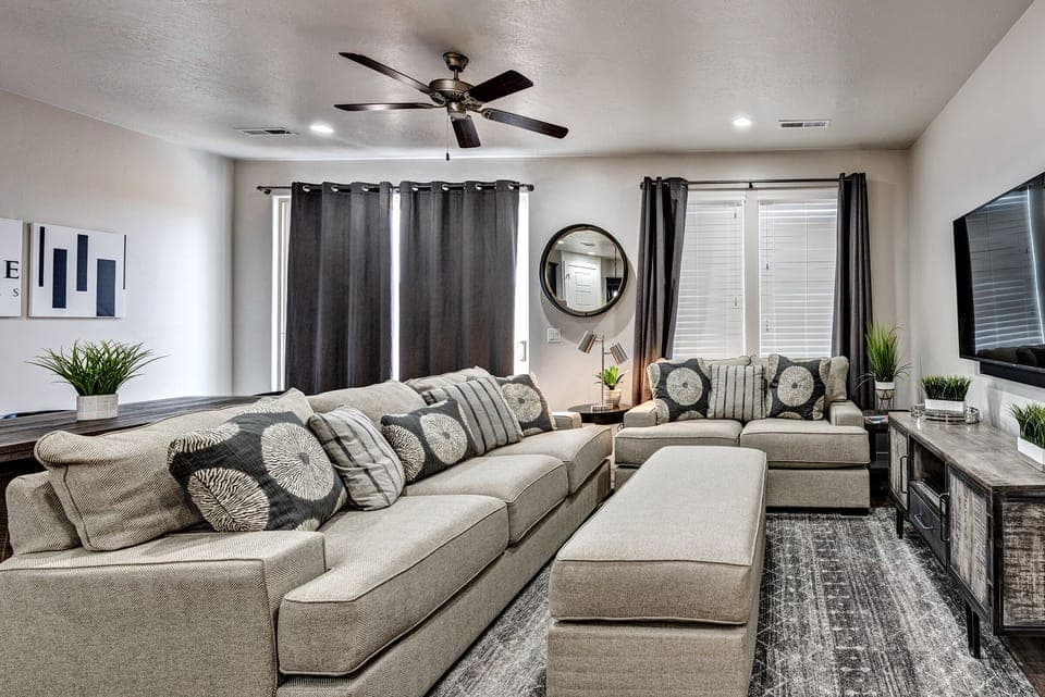 Living Room - The living room is designed as an open floor plan and is a great gathering place for meals, games, or watching TV during your stay.