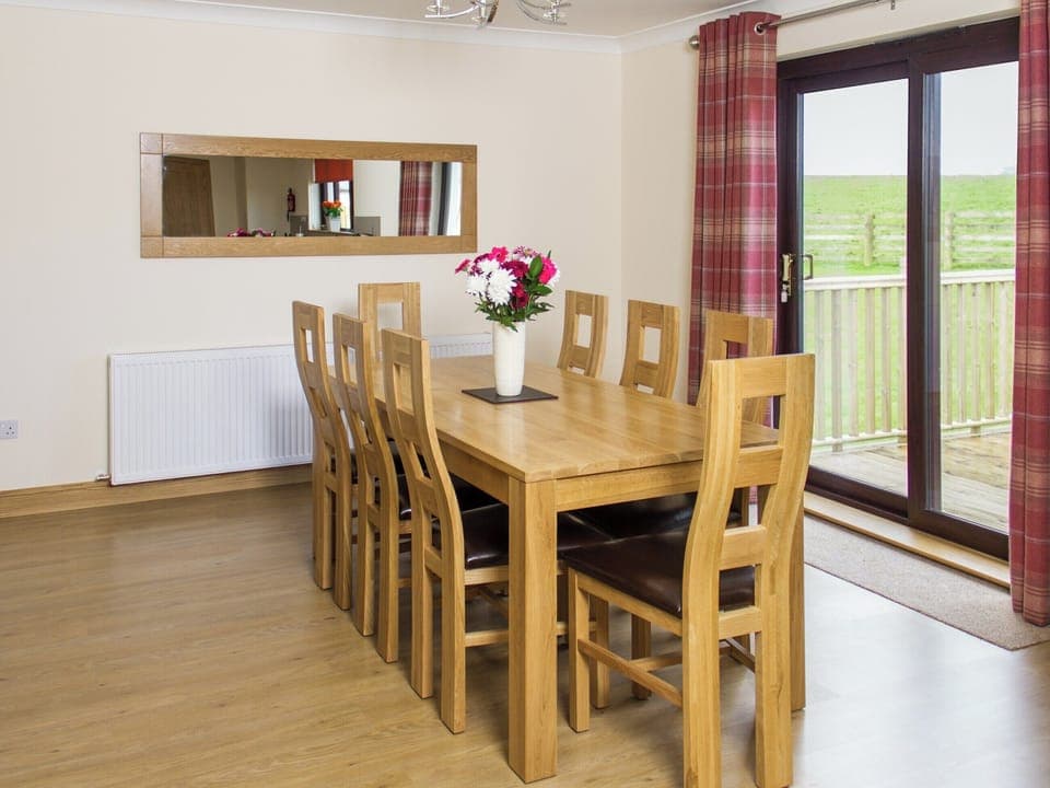 Large dining table with matching chairs for eight people | Seascape - Seascape Cottages, Southerness, near Dumfries