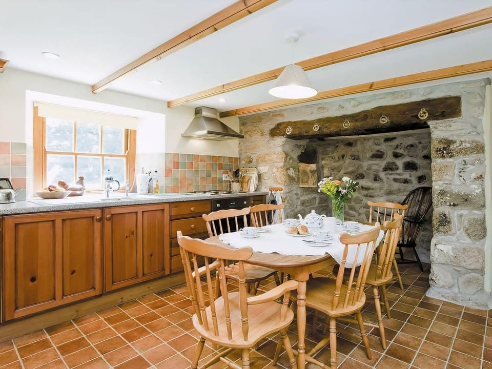 Well equipped kitchen/dining room with beams | Thatch Cottage, Rosudgeon, near Marazion