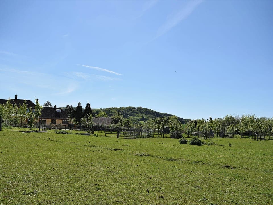 Setin glorious open countryside with Bredon Hill behind | The Lodge at Elmley Meadow, Elmley Castle, near Pershore