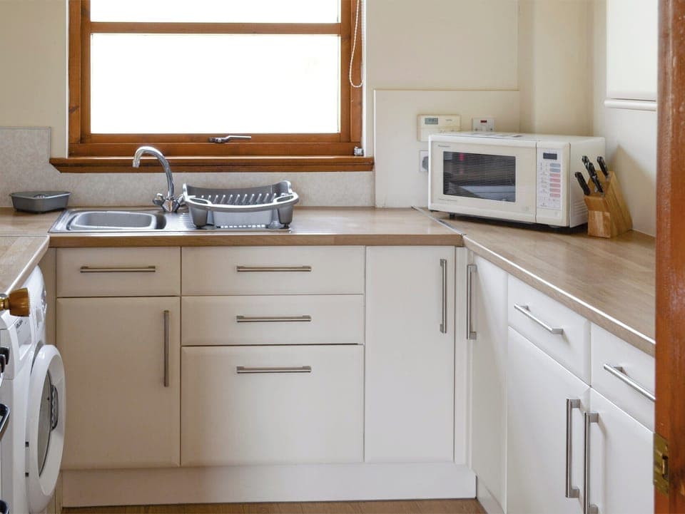Well-equipped fitted kitchen | Lochinchard Cottage, Kinlochbervie, Sutherland