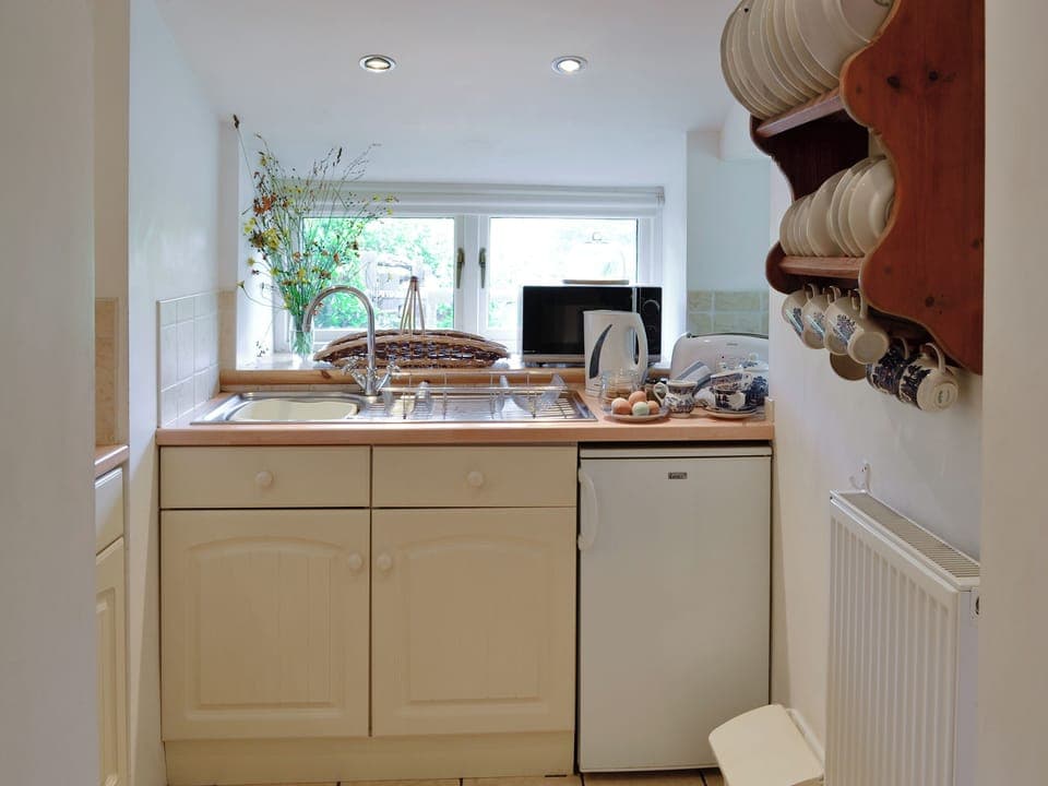 Compact fitted kitchen | Riverside Cottage, Betws-y-Coed