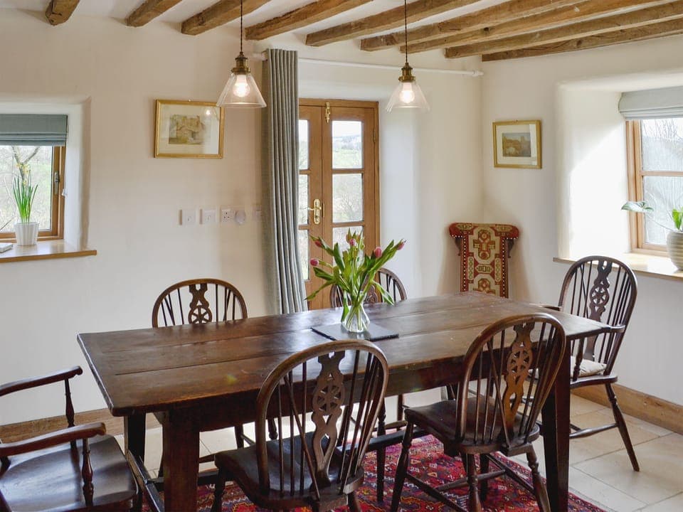 Delightful dining area with beamed ceiling | Bryn Gwnog, Llanrwst, near Betws-y-Coed