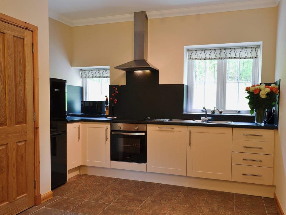 Large kitchen with tiled floor | Laundry Cottage, Ceannacroc