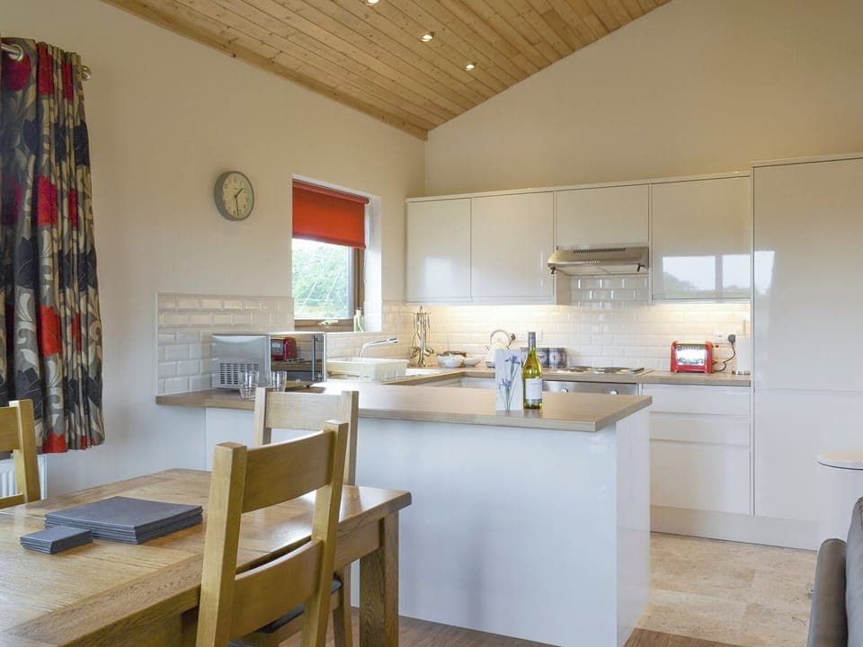 Spacious dining area and well-equipped kitchen | Hazel Lodge - Faulkers Lakes, Burgh le Marsh, near Skegness