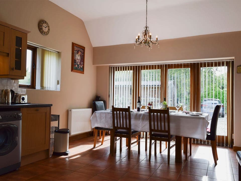 Large kitchen/dining room with terracotta tiled floor and French doors | Alfie&rsquo;s Barn, Ambrosden